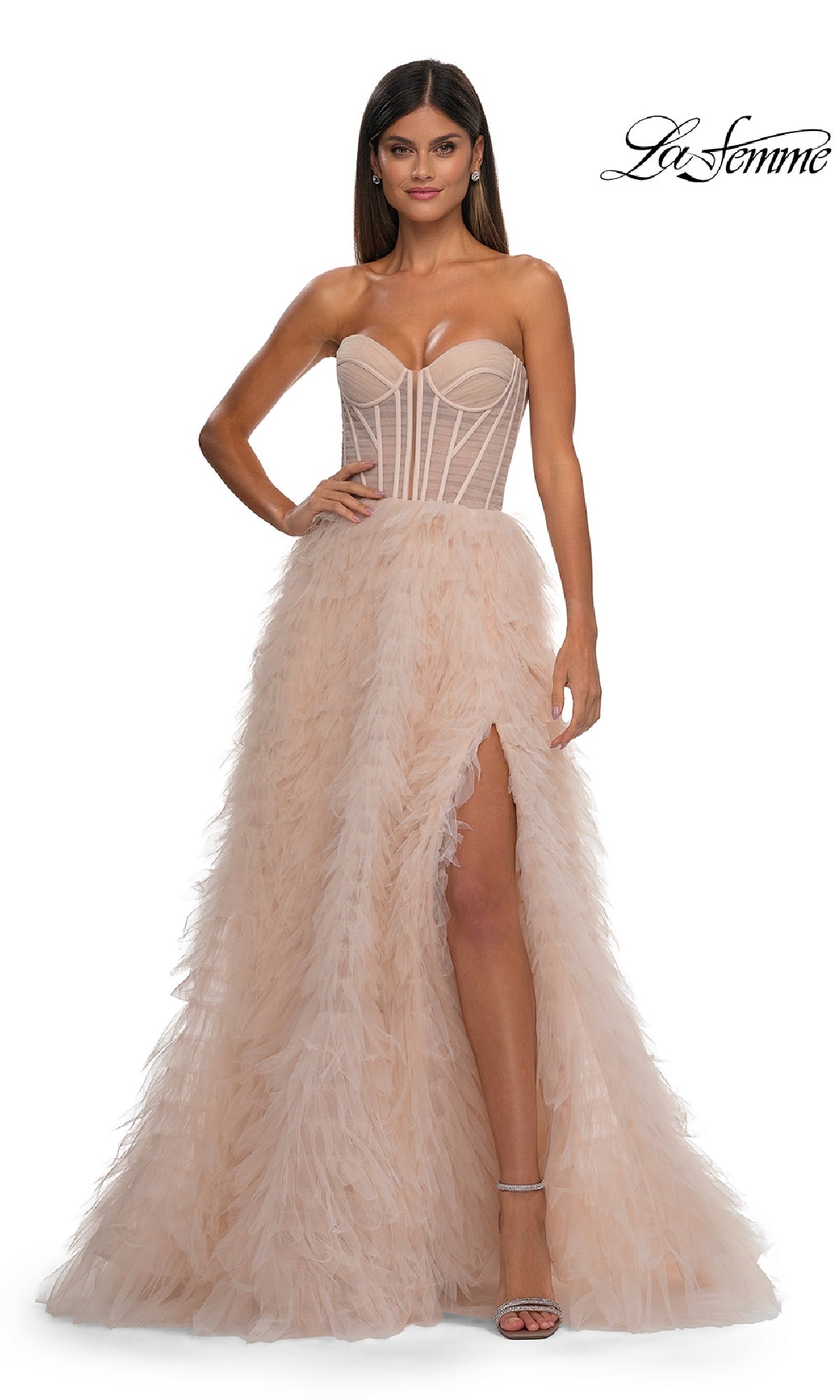 A woman wears the Strapless Ruffled Prom Ball Gown: La Femme 32528, featuring a corset-style bodice and feathered high-slit skirt. The La Femme logo appears in the top right corner.